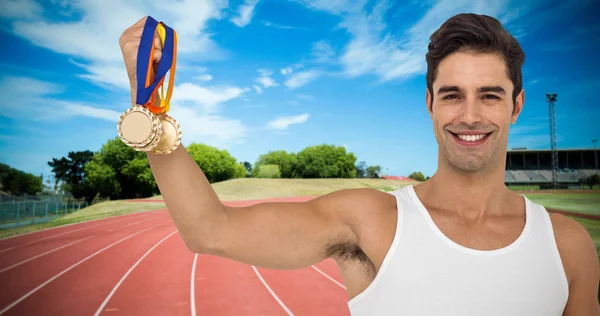 Atleta posando com medalhas de ouro — Fotografia de Stock