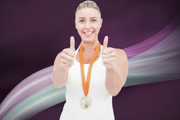 Female athlete wearing a medal — Stock Photo, Image