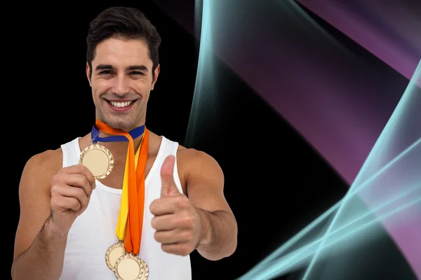 Idrottsman poserar med guldmedaljer — Stockfoto