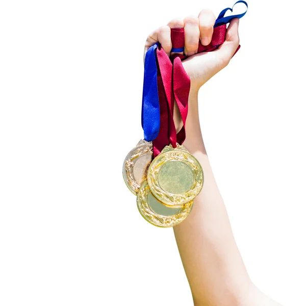 Mão segurando três medalhas — Fotografia de Stock