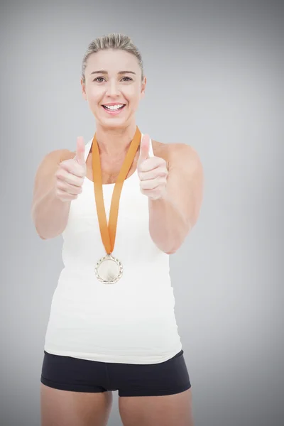 Female athlete wearing medal — Stock Photo, Image