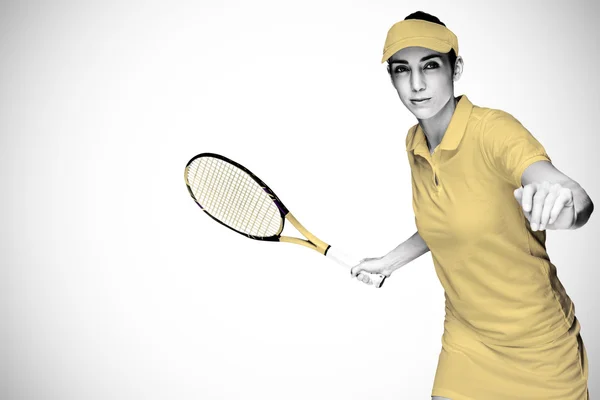 Athlète féminine jouant au tennis — Photo