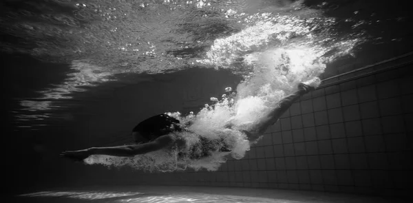 Athletic swimmer underwater — Stock Photo, Image