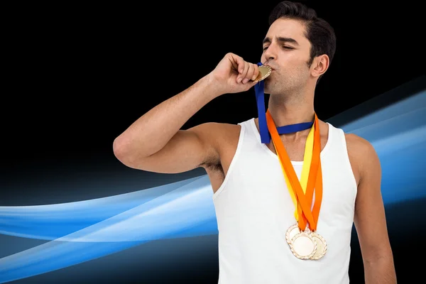 Athlete kissing medal — Stock Photo, Image