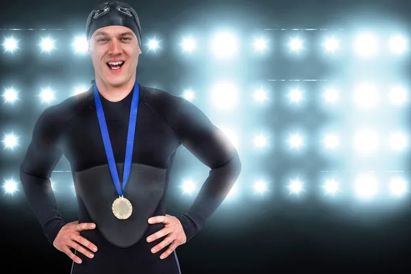 Victorious swimmer posing with gold medal — Stock Photo, Image