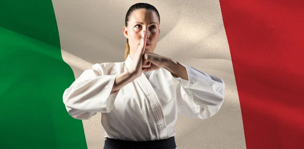 Female fighter performing hand salute — Stock Photo, Image