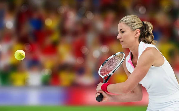 Athlete playing tennis with a racket — Stock Photo, Image