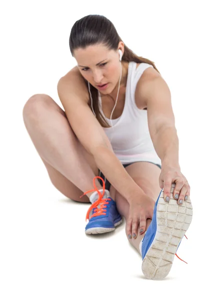 Athlete woman stretching her hamstring — Stock Photo, Image