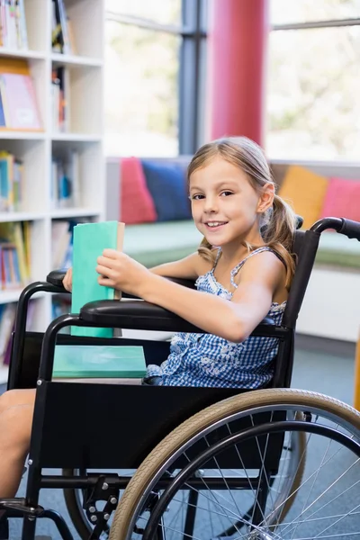 Disabled school girl on wheelchair — Stock Photo, Image