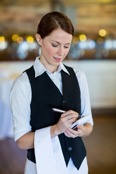 Smiling waitress taking order — Stock Photo, Image