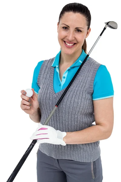 Golf player holding a golf club and golf ball — Stock Photo, Image