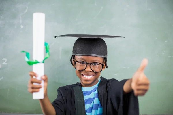 Schoolboy showing thumbs up — Stock Photo, Image