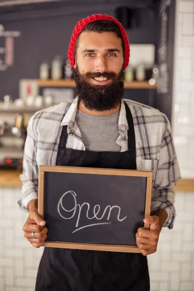 Waiter holding board written open — Stock Photo, Image