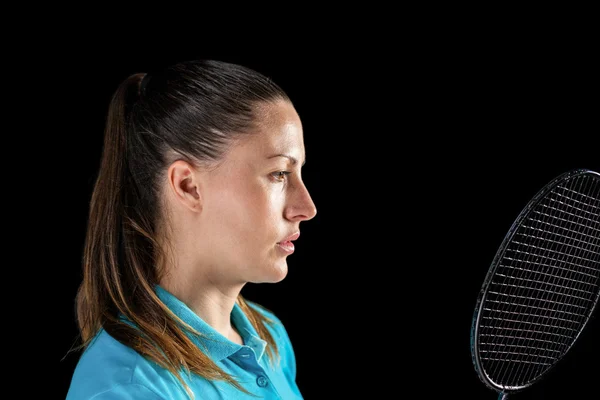 Atleta donna che tiene racchetta da badminton — Foto Stock