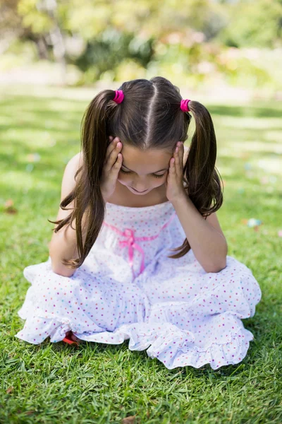 Upset girl with hand on forehead — Stock Photo, Image