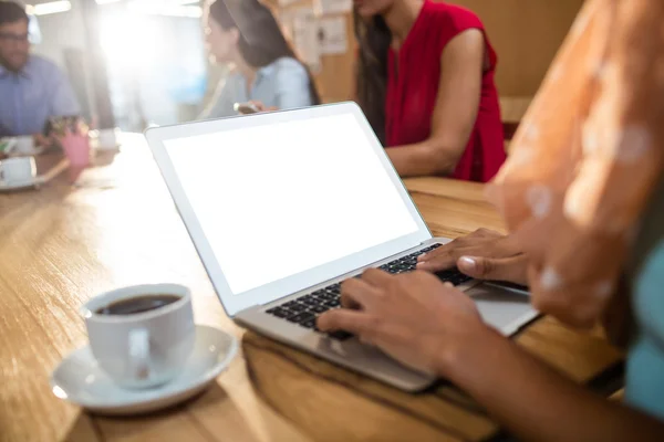 Hipster businesswoman using a laptop — Stock Photo, Image