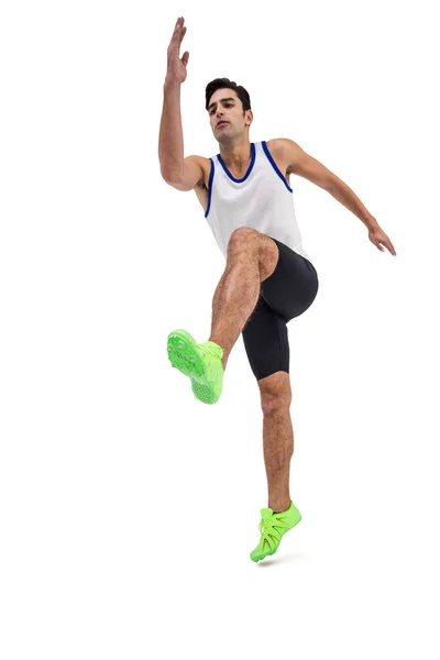 白い背景の上を実行しているオスの運動選手 — ストック写真