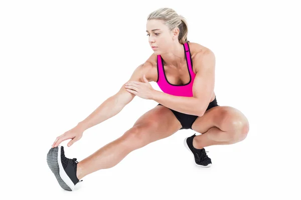 Female athlete stretching — Stock Photo, Image