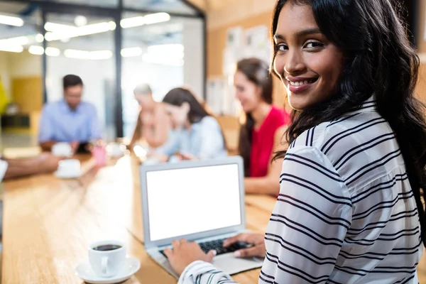 Hipster businesswoman using laptop — Stock Photo, Image