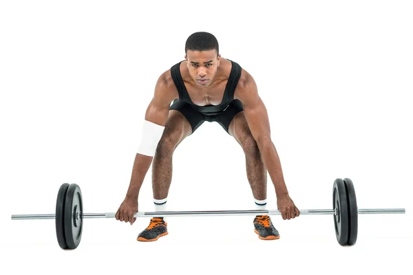 Bodybuilder lifting heavy barbell weights — Stock Photo, Image