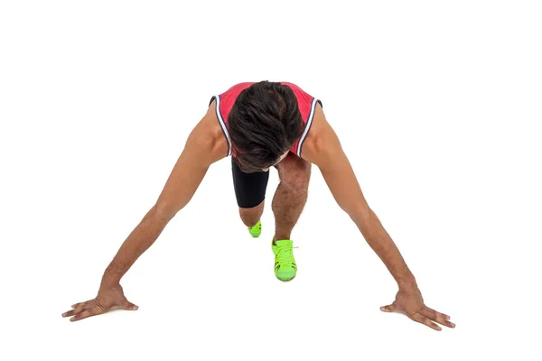 Atleta masculino em posição pronta para correr — Fotografia de Stock