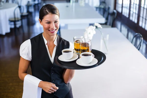 Waitress holding serving tray — Stock Photo, Image