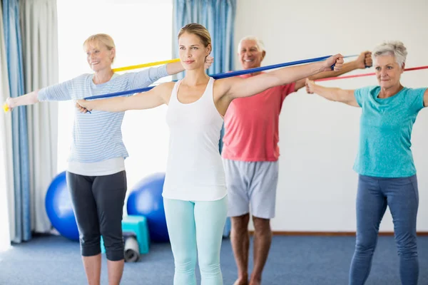 Instructor and seniors exercising — Stock Photo, Image