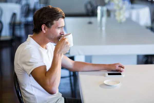 Man drinking cup of coffee — Stock Photo, Image