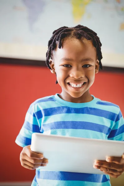 Schoolboy holding tablet Stock Picture