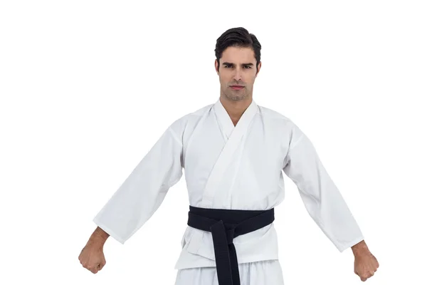 Male karate player posing on white background — Stock Photo, Image