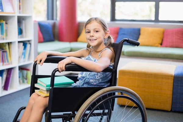 Disabled school girl with books — Stock Photo, Image