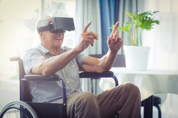 Happy senior man on wheelchair using VR headset — Stock Photo, Image