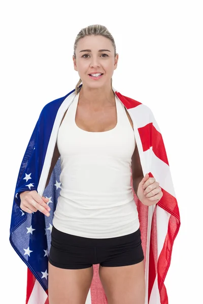 Жінка-спортсменка з американським прапором на плечах — стокове фото