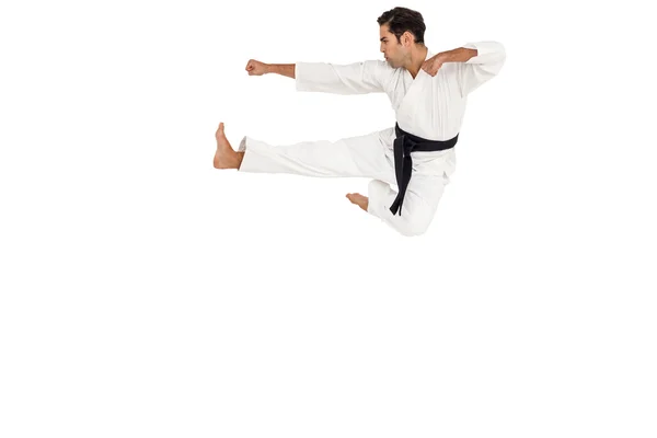 Combatiente realizando postura de karate — Foto de Stock