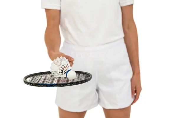 Athlete holding badminton racket and shuttlecock — Stock Photo, Image