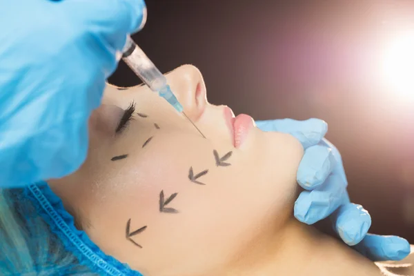 Woman receiving botox injection on lips — Stock Photo, Image