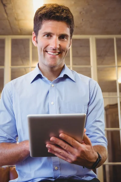 Businessman posing with tablet — Stock Photo, Image