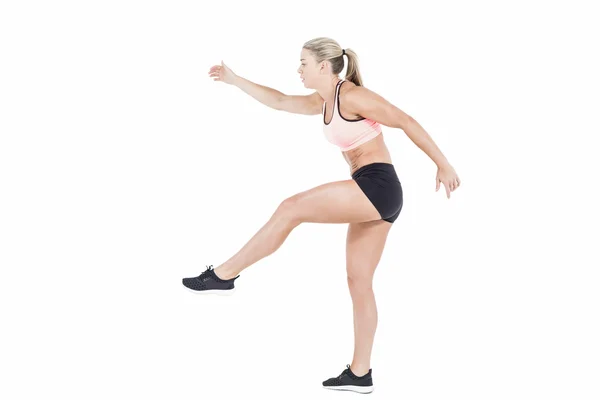 Female athlete jumping — Stock Photo, Image