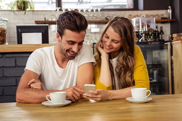 Couple using a smartphone — Stock Photo, Image