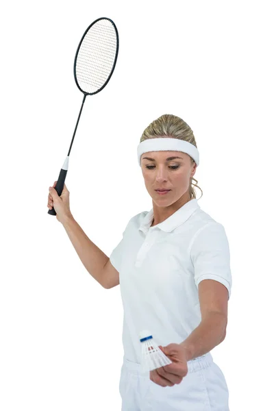 Atleta feminina segurando uma raquete de badminton pronta para servir — Fotografia de Stock