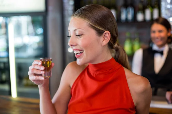 Woman holding tequila shot — Stock Photo, Image