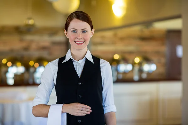 Waitress with napkin draped over hand — Stock Photo, Image