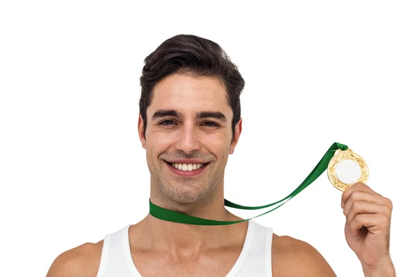 Sportowiec pozowanie z złote medale wokół szyi — Zdjęcie stockowe