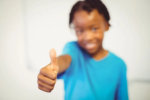 Smiling schoolboy showing thumbs — Stock Photo, Image