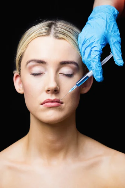 Woman receiving botox injection on lips — Stock Photo, Image