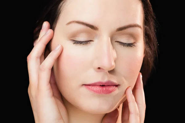 Woman face on black background — Stock Photo, Image