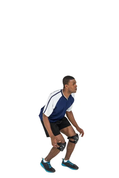 Sportsman posing while playing volleyball — Stock Photo, Image