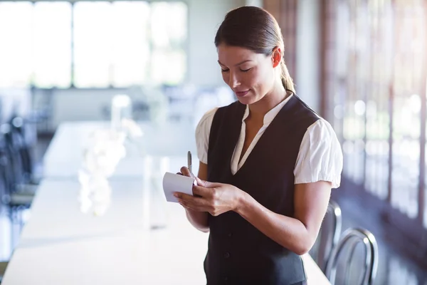 Smiling waitress taking order — Stock Photo, Image