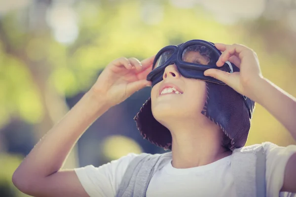 Boy in aviator goggles looking up — Stock Photo, Image