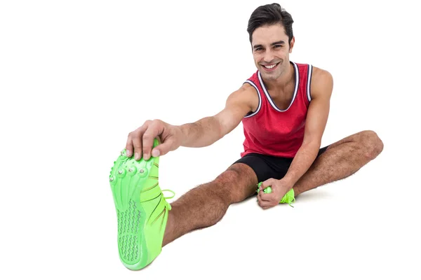 Portret van mannelijke atleet stretching oefening doen — Stockfoto